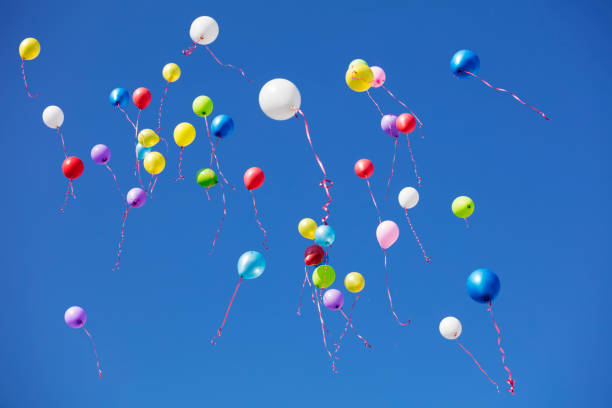 istock Colored flying balloons in the blue sky 959536082