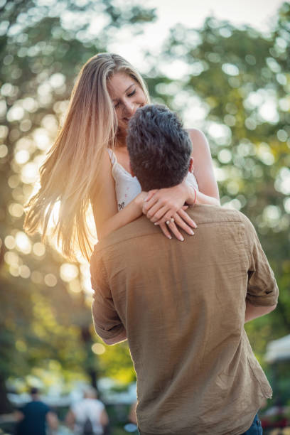 istock Man lifting up his smiling girlfriend 959537846