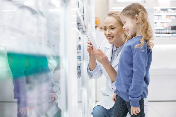 istock Nice female pharmacist educating girl 959537858
