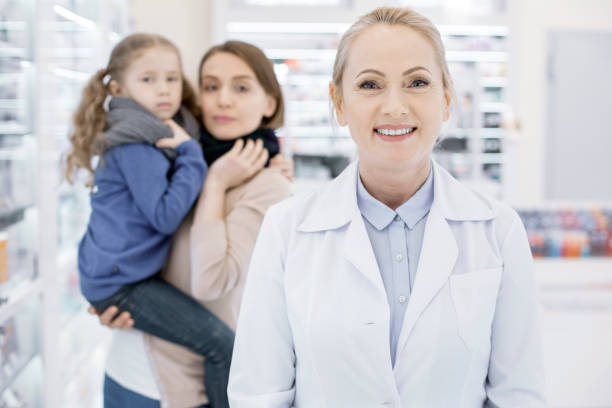 istock Happy female pharmacist doing her job 959538094