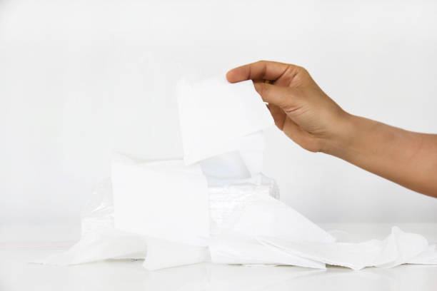 istock The blurry light design background of tissue paper was pull by human hand. 959542910