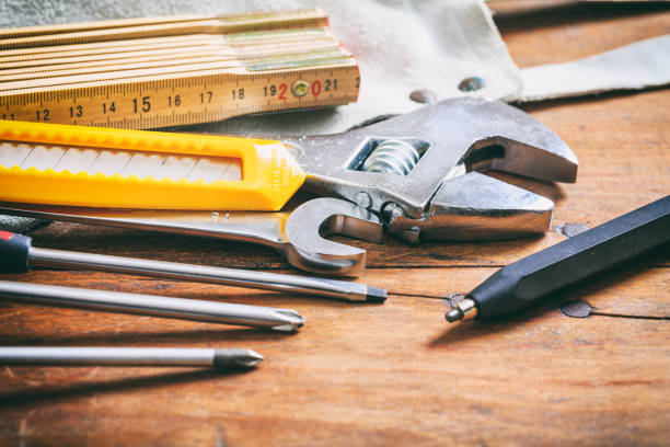 istock Set of hand tools on a wooden surface 959546300