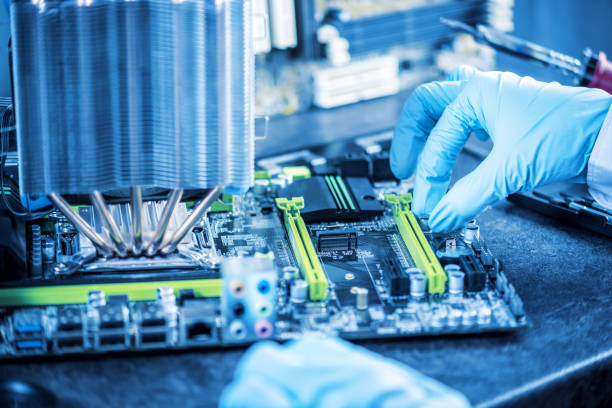 istock Engineer technician computers in gloves on the hands is reviewing the failure. Concept of repair microchip 959546302
