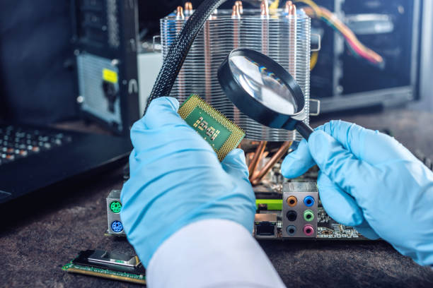 istock Engineer technician computers in gloves on the hands is reviewing the failure. Concept of repair microchip 959546342