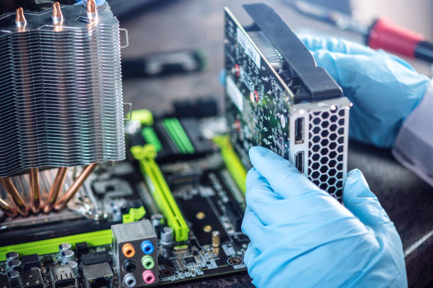 istock Engineer technician computers in gloves on the hands is reviewing the failure. Concept of repair microchip 959546412