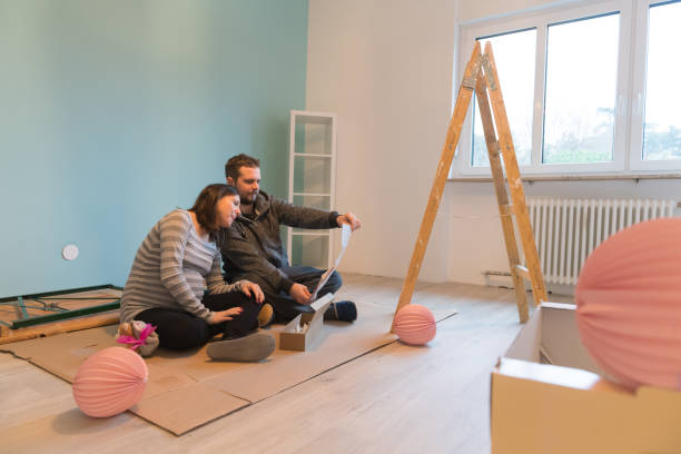 Pregnant couple in a new home