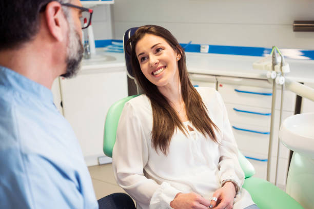 istock Young woman at dentist 959552176