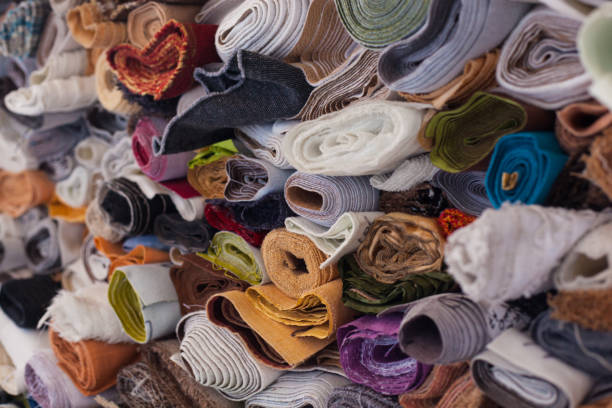 istock Fabric folded with rolls of different colors folded on top of each other 959556246