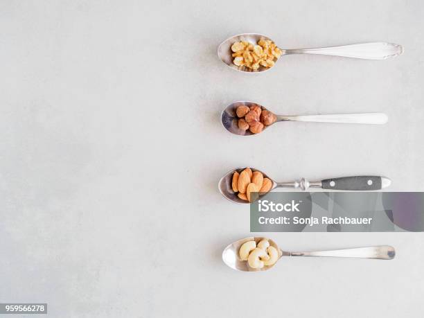 Nuts On Metal Spoons Stock Photo - Download Image Now - Allergy, Food, Food and Drink