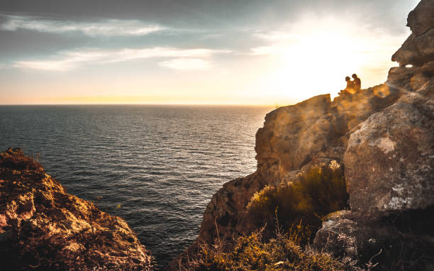 istock sunset among rocks with the sea in the background 959567122