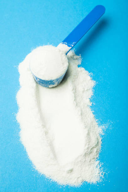 istock Milk powder in a measuring spoon 959567986