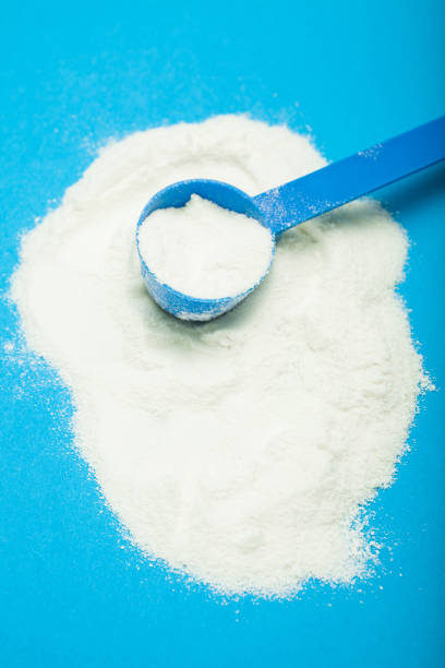 istock Milk powder in a measuring spoon 959568020