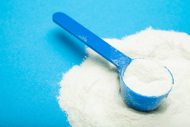 istock Milk powder in a measuring spoon 959568024