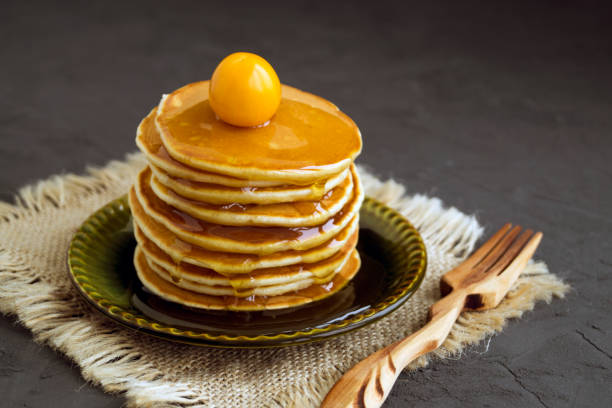 istock Pancakes with honey on a gray background 959577582