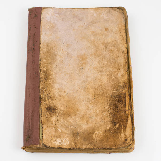 istock Top view of blank old book with grange pages isolated on white background 959581368