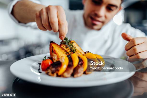 Making Dinner Into A Masterpiece Stock Photo - Download Image Now - Chef, Restaurant, Food