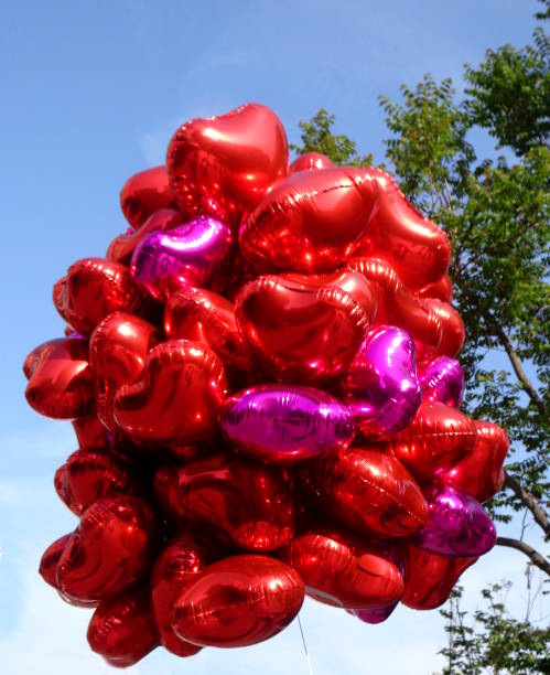 istock Shiny balloons in the air 959584366