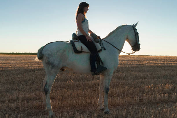 istock woman on horseback 959584696