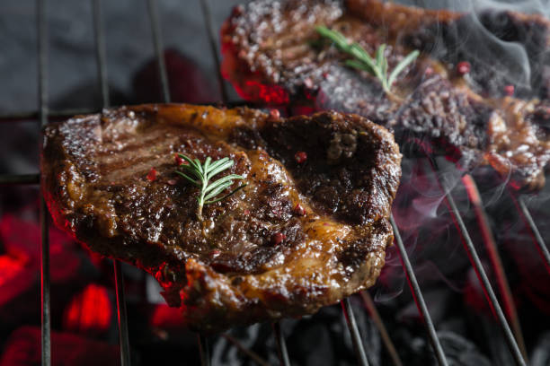 istock Pieces of marbled beef on the grill 959584854