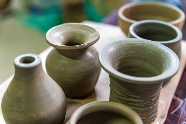istock Freshly made clay vases in pottery workshop 959585028