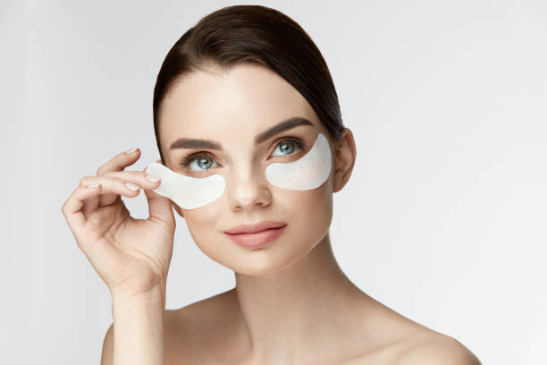 istock Woman Beauty Face With Mask Under Eyes 959585282