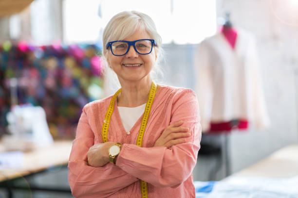 istock Confident senior fashion designer in her workshop 959585566