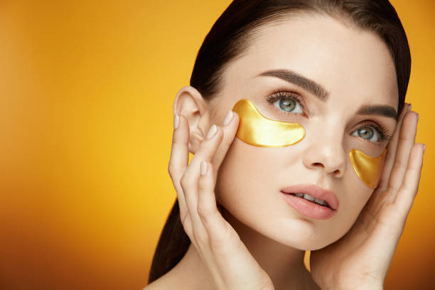 istock Woman Beauty Face With Mask Under Eyes 959590072