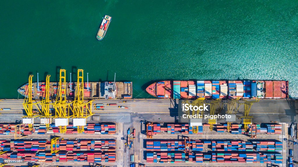 Aerial view of  Deep water port with cargo ship and container Freight Transportation Stock Photo