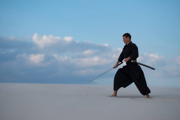 istock Focused man with a Japanese sword - a katana 959598658