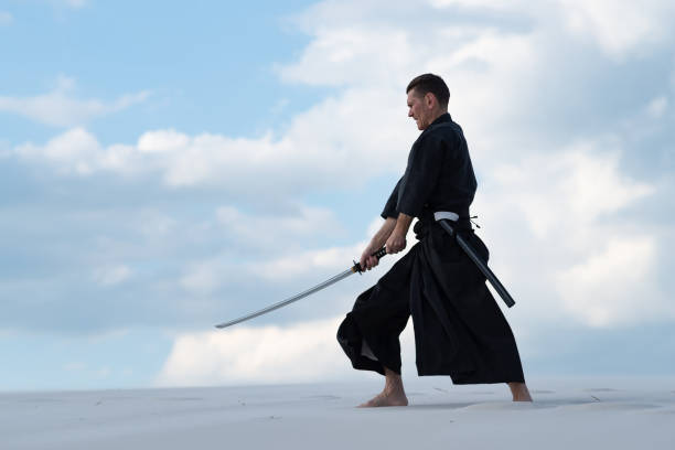 istock Man is practicing Japanese martial art - iaido 959598750