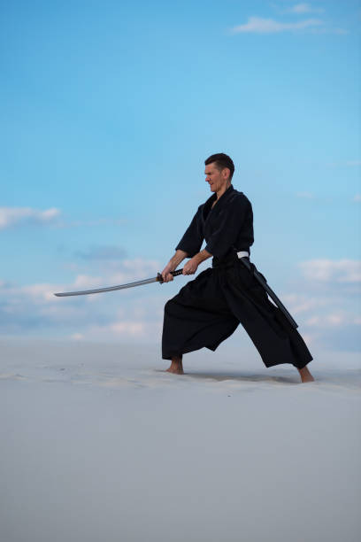 istock Focused man is training martial arts in desert 959599046