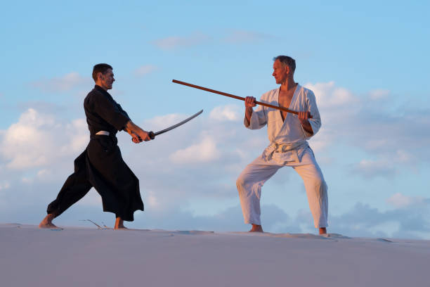 istock Men are practicing martial arts with traditional Japanese weapon 959599620