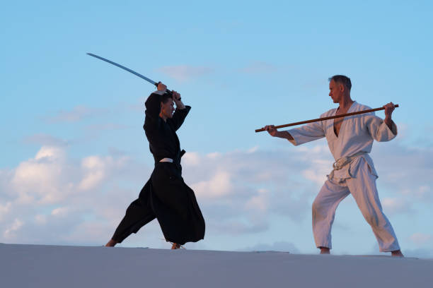 istock Men are practicing martial arts with a traditional Japanese weapon 959599636