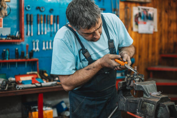 istock Manual worker repairing electric motor in a workshop 959601240