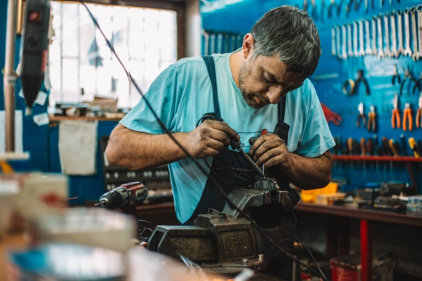 istock Manual worker repairing electric motor in a workshop 959604246