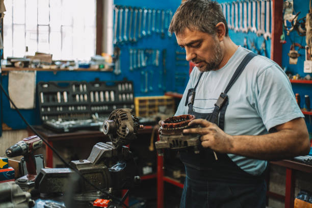 istock Manual worker repairing electric motor in a workshop 959604338