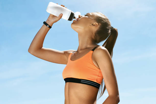 istock Woman Drinking Water After Running. 959604414