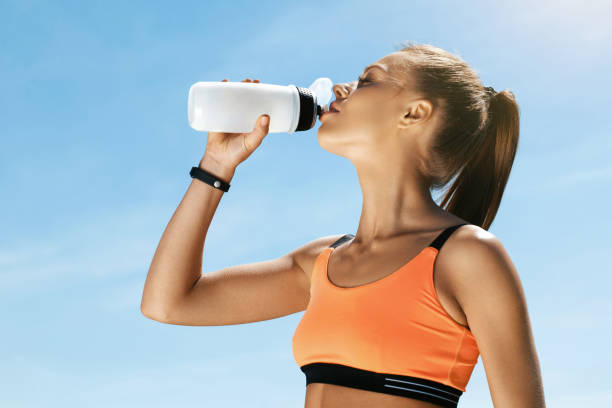 istock Woman Drinking Water After Running. 959604440