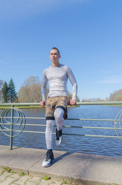 istock a man in a white sports uniform, warming up 959605192