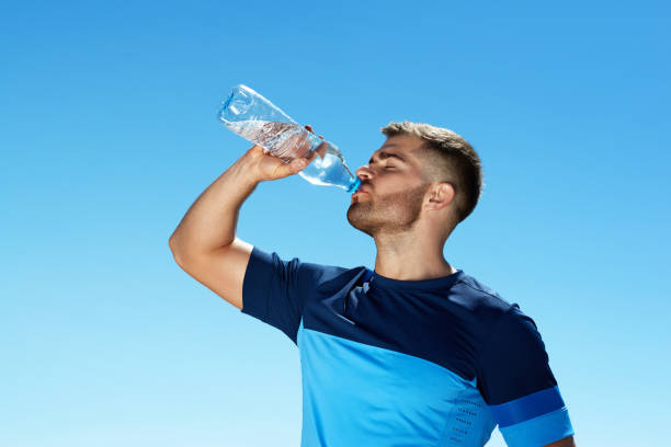 istock Man Drinking Water After Running. Portrait. 959605492