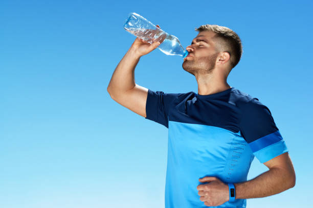 istock Man Drinking Water After Running. Portrait. 959605522