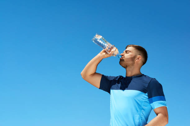 istock Man Drinking Water After Running. Portrait. 959605622