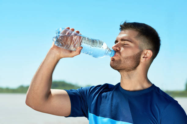 istock Man Drinking Water After Running. Portrait. 959605678