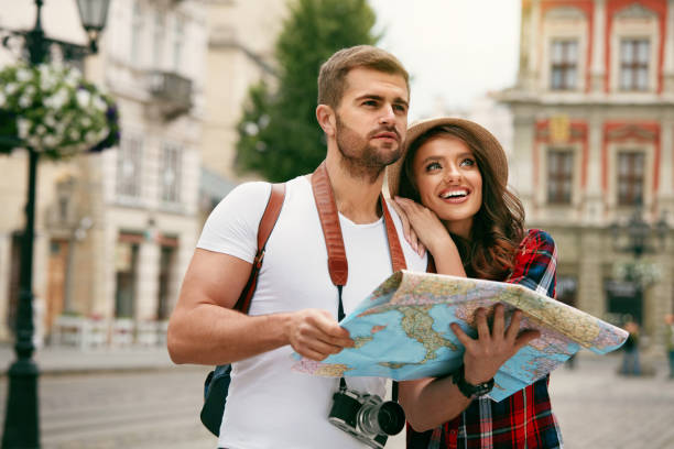 istock Happy Tourists. Beautiful Couple Sightseeing With Map. 959614744