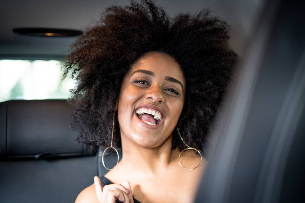 istock Afro young descent woman inside a luxury car 959614784