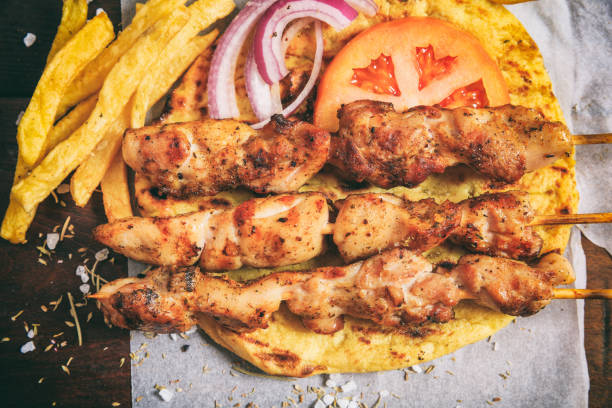 istock Grilled meat skewers on a wooden background 959618620