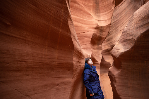 Red sandstone texture of the lower antelope canyon with perfect light from above.