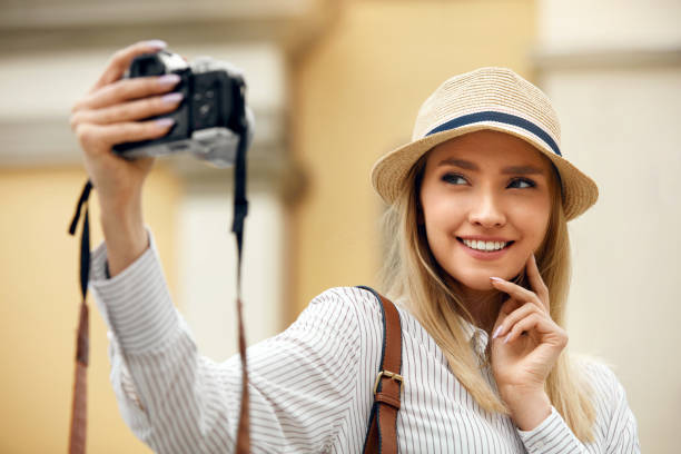 istock Beautiful Happy Girl Taking Photos On Camera. 959625682