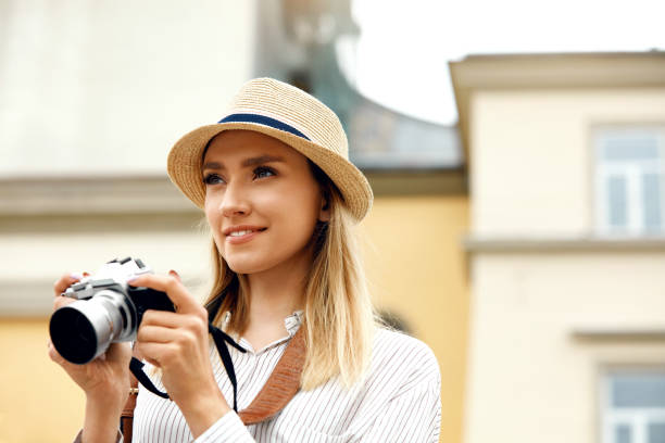 istock Tourist Girl With Camera Taking Photos On Street. 959626444