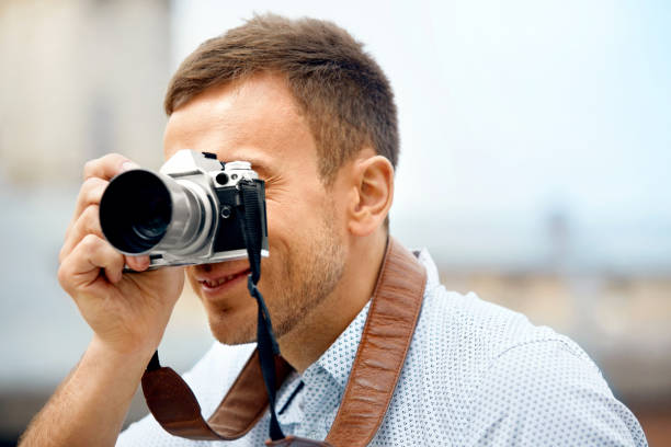 istock Tourist Man With Camera Taking Photos On Street. 959626716